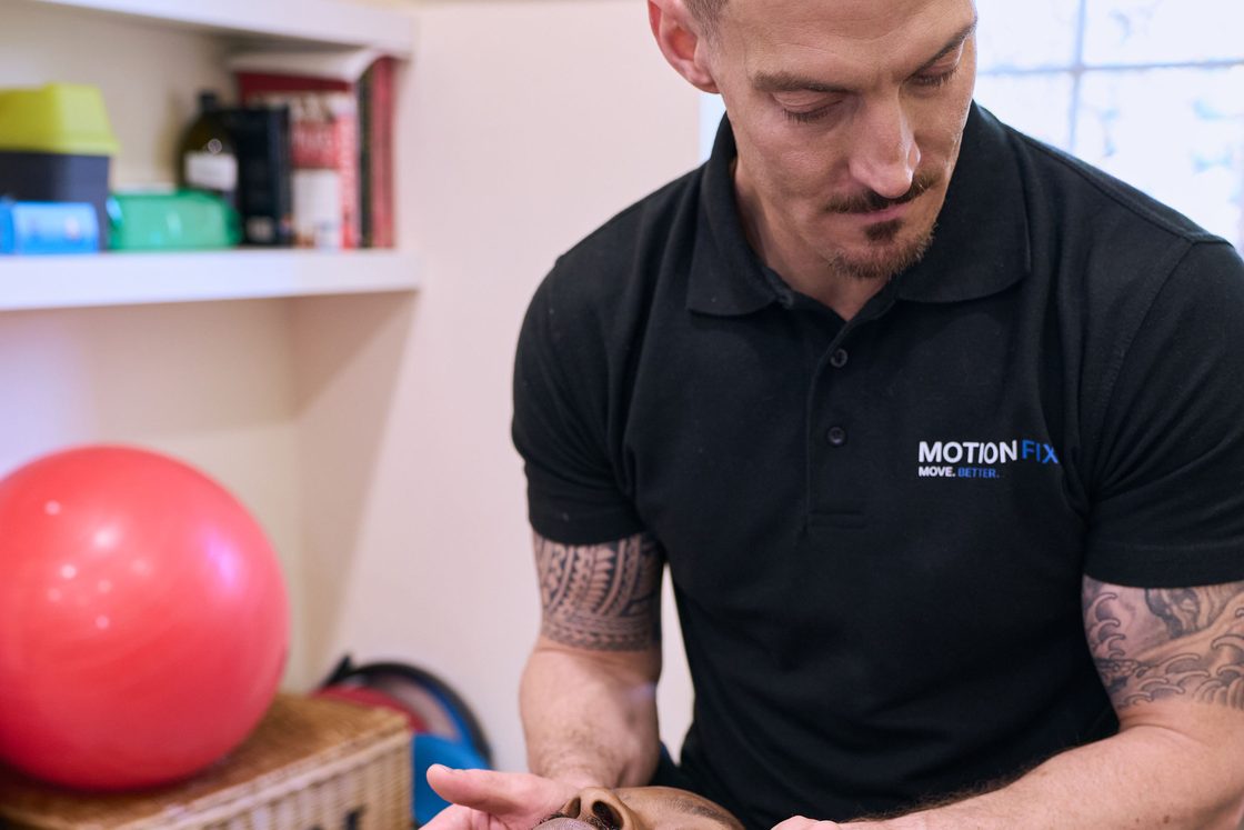 Chiropractor treating the upper neck to address headaches at MotionFix, Elephant & Castle